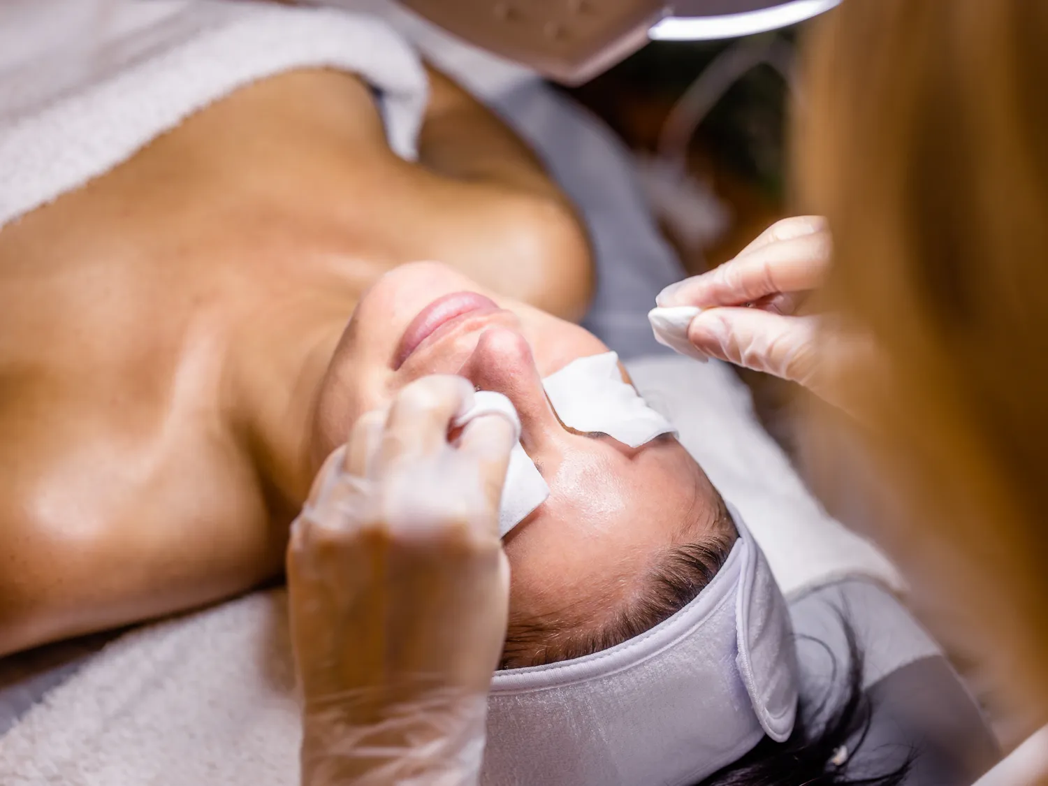 A woman enjoying a relaxing facial