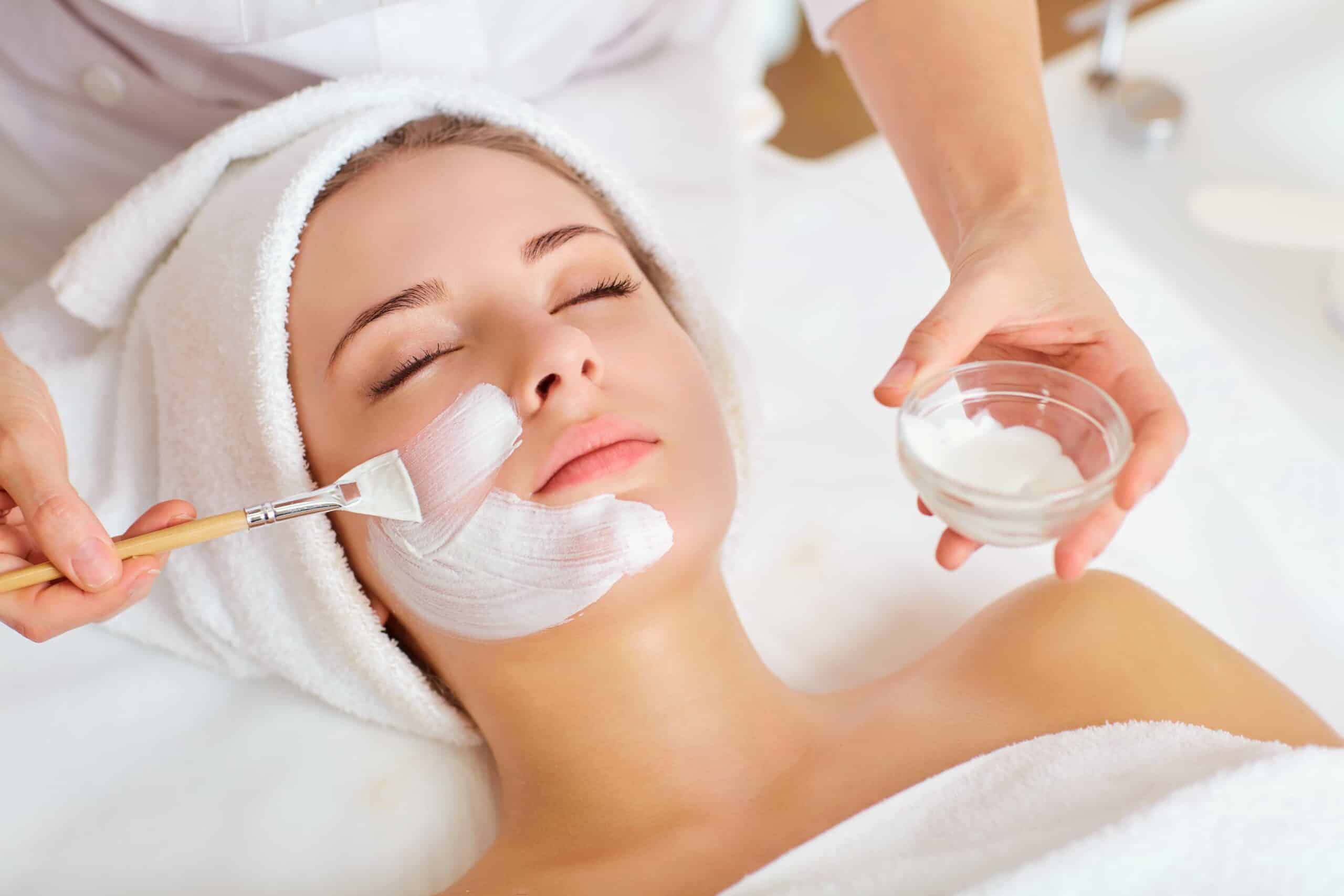 A woman relaxing during a facial