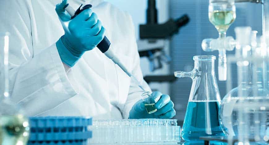A lab technician running tests