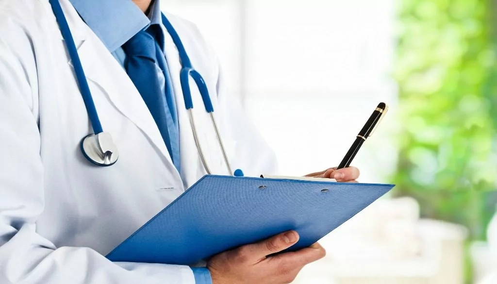 A concierge doctor holding a clipboard