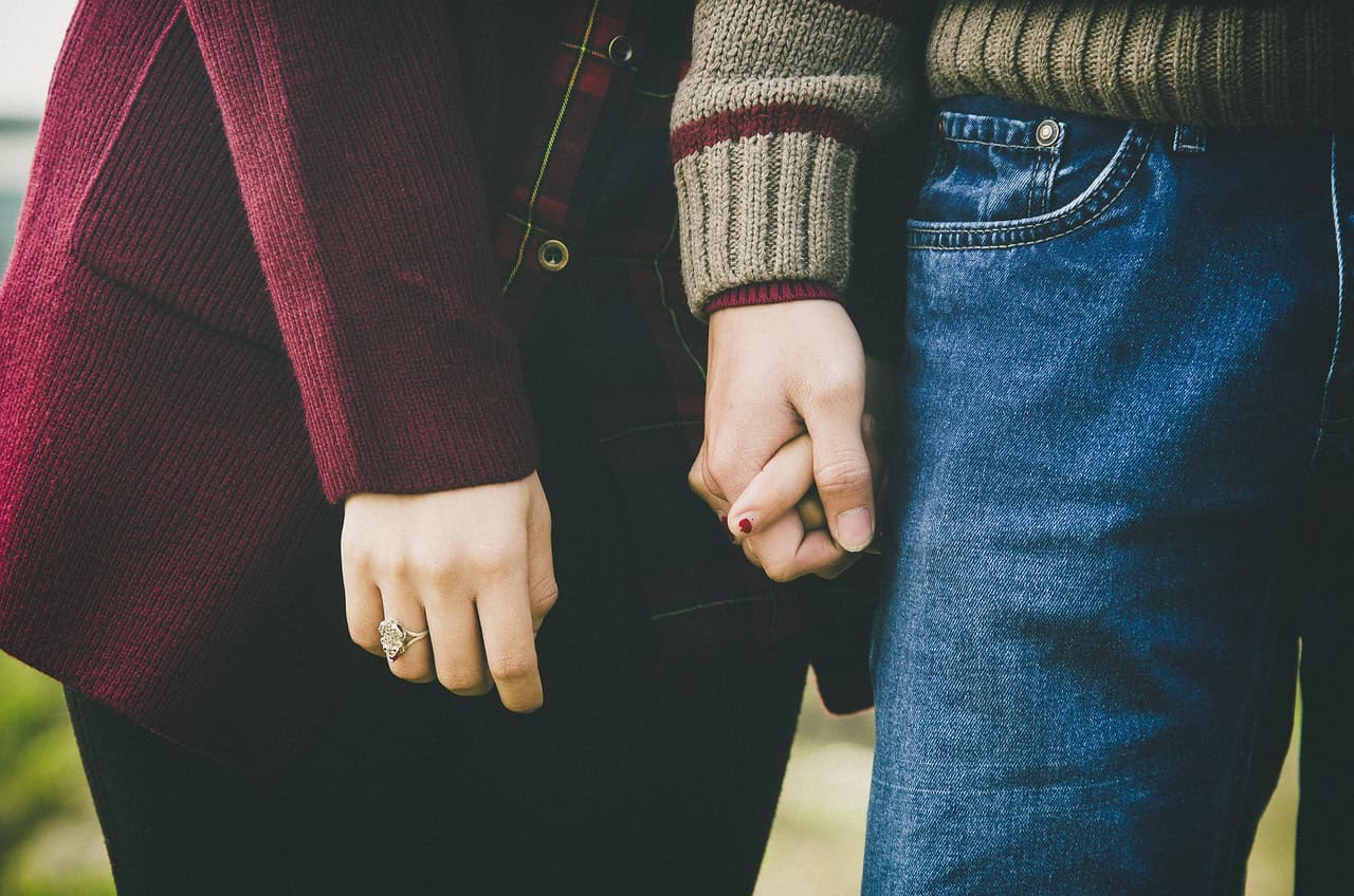A couple holding hands
