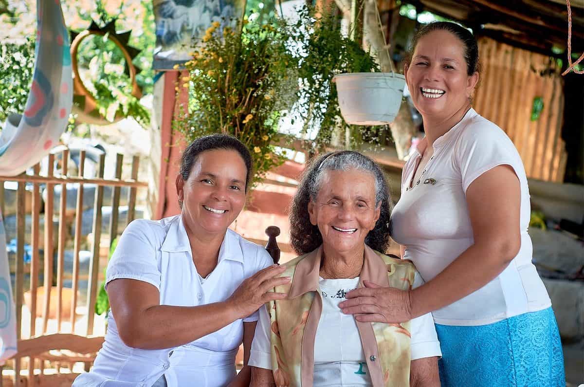 Three generations of a family smiling together