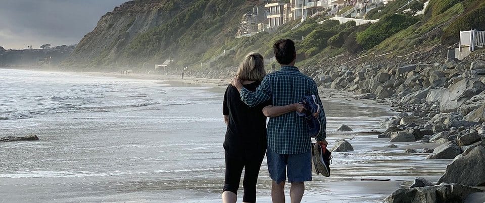 A couple walking on the beach